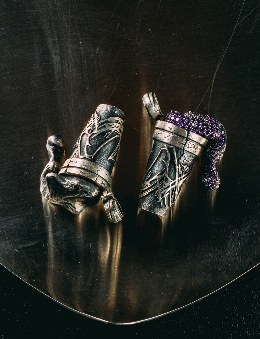 Metal jewelry on a dark surface